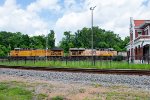 UP 5743 leads a westbound freight by the former T&P Depot 